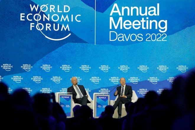 German chancellor Olaf Scholz, right, sits besides Klaus Schwab, founder and executive chairman, World Economic Forum, at the World Economic Forum in Davos, Switzerland, in this May 26, 2022, file photo. The annual meeting of the World Economic Forum took place in Davos from May 22 until May 26. (data credit: Markus Schreiber, AP)