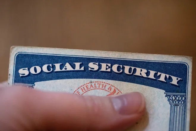 A Social Security card is displayed on Oct. 12, 2021, in Tigard, Ore. The annual Social Security and Medicare trustees report released Thursday, June 2, 2022, says Social Security's trust fund will be unable to pay full benefits in 2035, instead of last year's estimate of 2034, and the year before that which estimated an exhaustion date of 2035. (AP Photo/Jenny Kane, File)