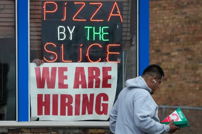 A hiring sign is displayed at a restaurant in Prospect Heights, Ill., Tuesday, April 4, 2023. On Friday, the U.S. government issues the March jobs report. (AP Photo/Nam Y. Huh) Nam Y. Huh, AP