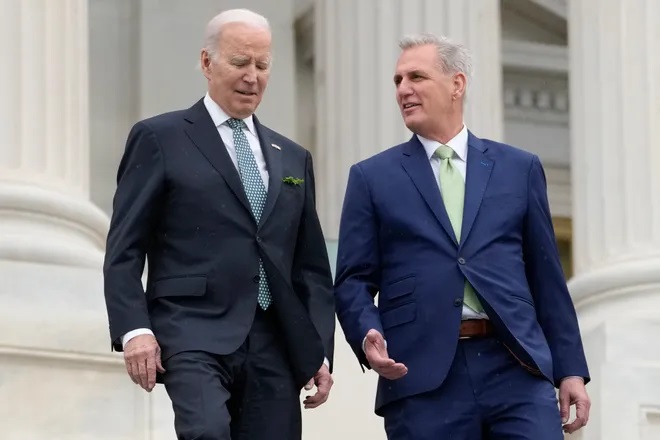 President Joe Biden talks with House Speaker Kevin McCarthy of Calif., as they walk down the House steps as they leave after attending an annual St. Patrick's Day luncheon gathering at the Capitol in Washington, March 17, 2023. The Tuesday, May 9, White House sitdown between the president and congressional leaders will be the first substantive talks between Biden and McCarthy in months, and comes weeks after House Republicans voted on a bill that would raise the debt limit but impose significant federal spending cuts. (AP Photo/Alex Brandon)