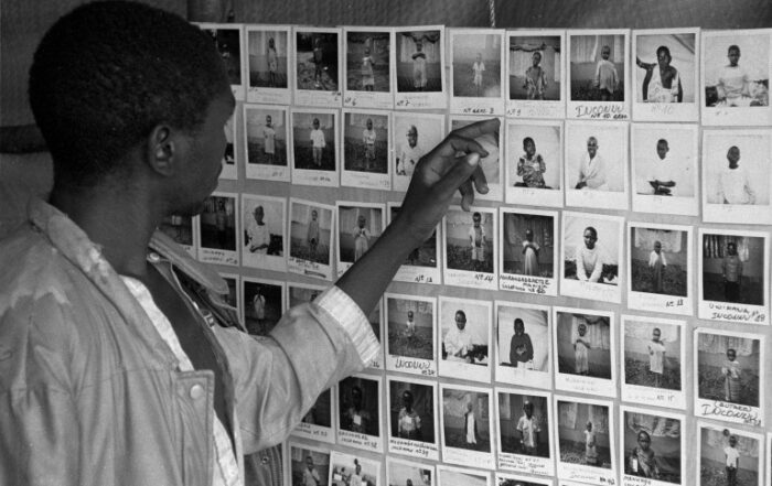 A father is searching for his missing child using ICRC assistance during the 1994 Rwandan Genocide. (Photo: British Red Cross)